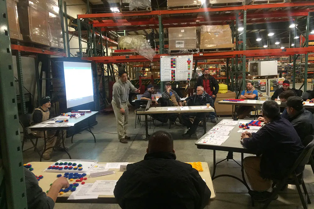 Kocer running a Lean training session on the shop floor