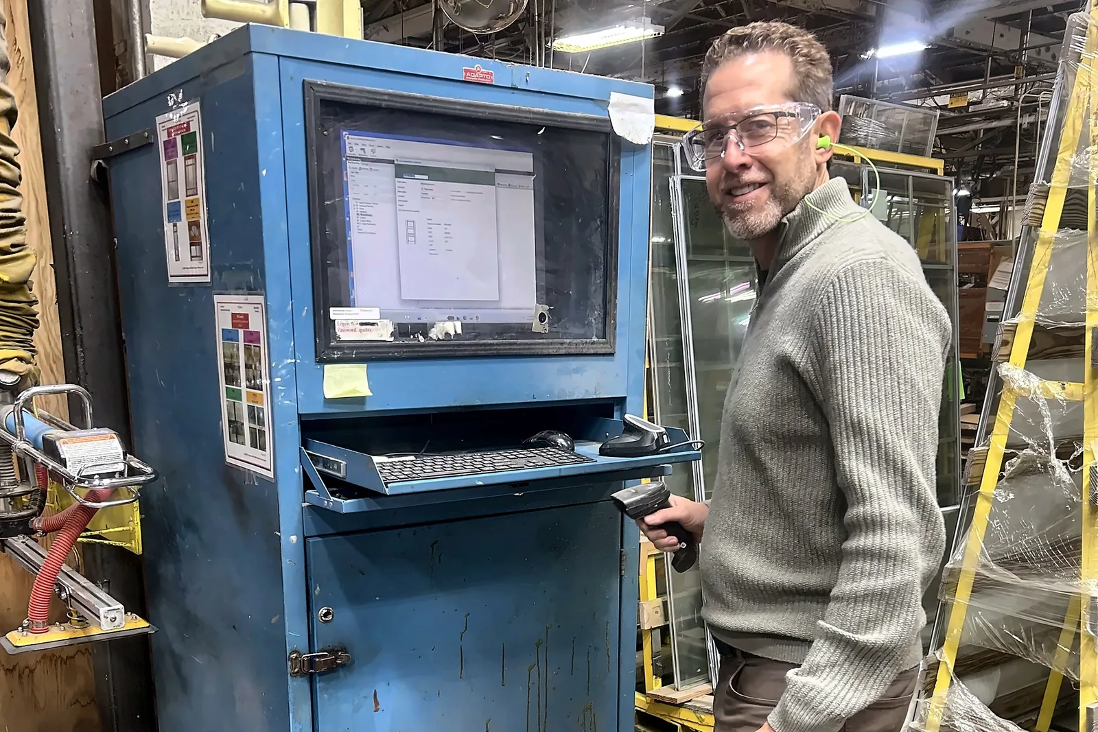 Kocer consultant using a barcode scanner at a shop-floor computer workstation